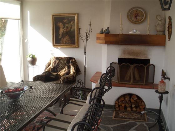 Wintergarten mit offenem Kamin